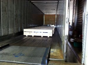 Large flat item being loaded into a truck