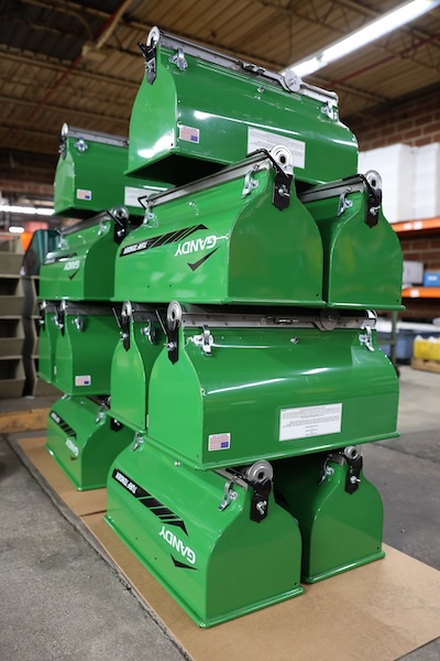 Stack of green Gandy products